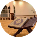 A quran placed on a wooden stand in a well-lit mosque room, symbolizing a peaceful and spiritual setting.